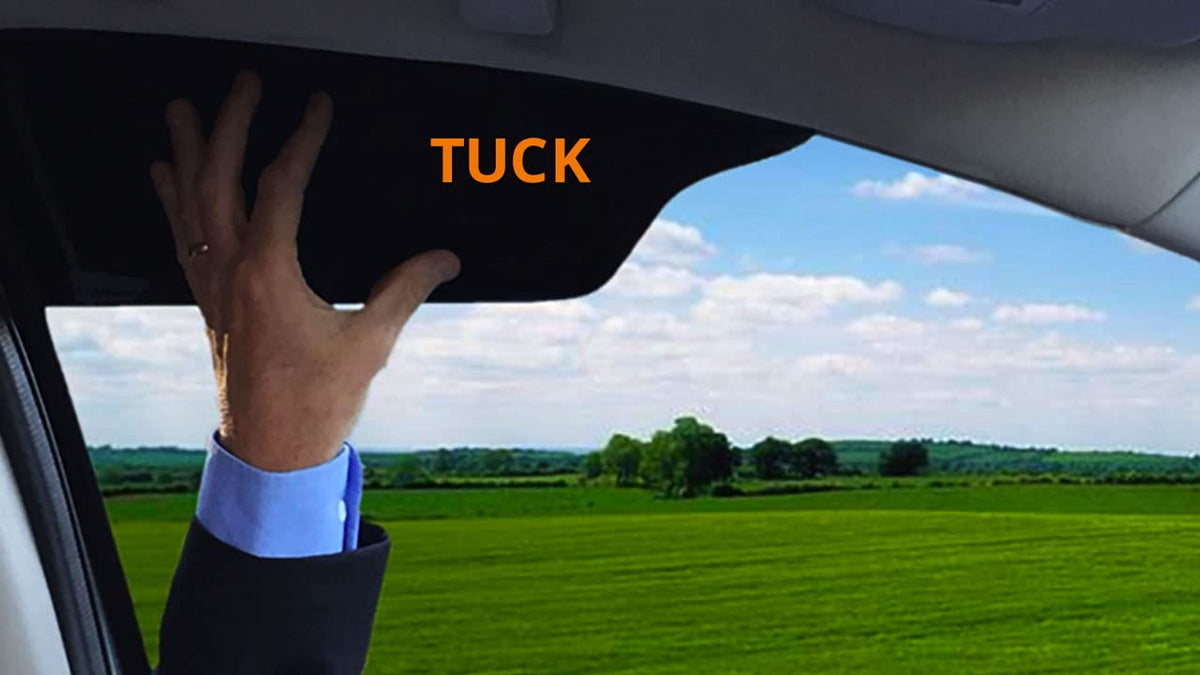 TuckVisor tucked into a driver-side window reducing sun and improving visibility
