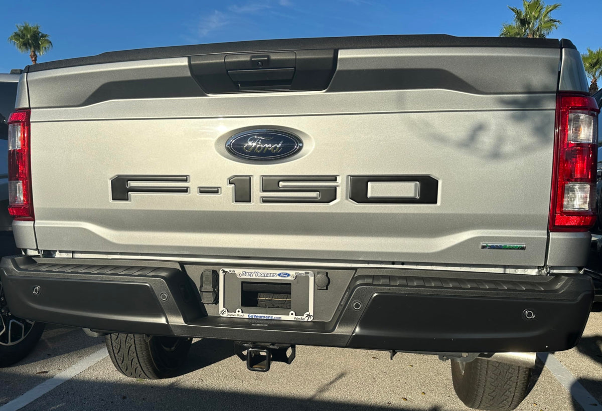 TufSkinz front view of F-150 tailgate emblem insert showing precise OEM fit and refreshed look
