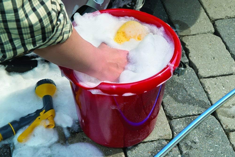 Turtle Wax applied with mitt on car, producing rich foam and easier rinsing