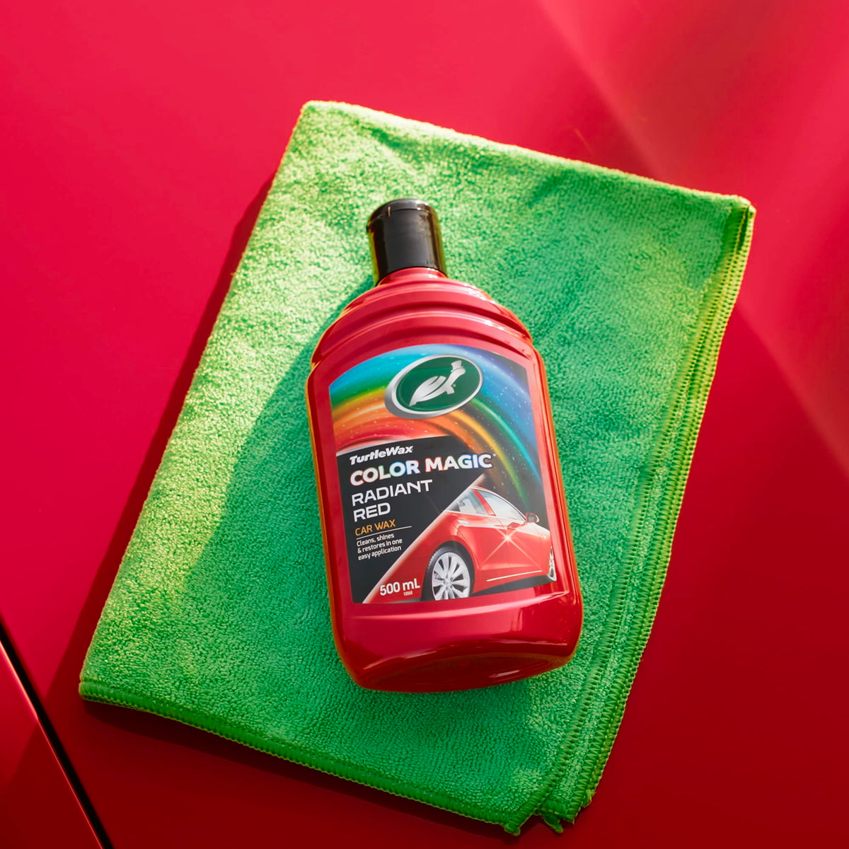Turtle Wax being applied to car door delivering visible colour revival