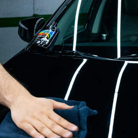 Turtle Wax applied on car panel demonstrating quick colour restoration