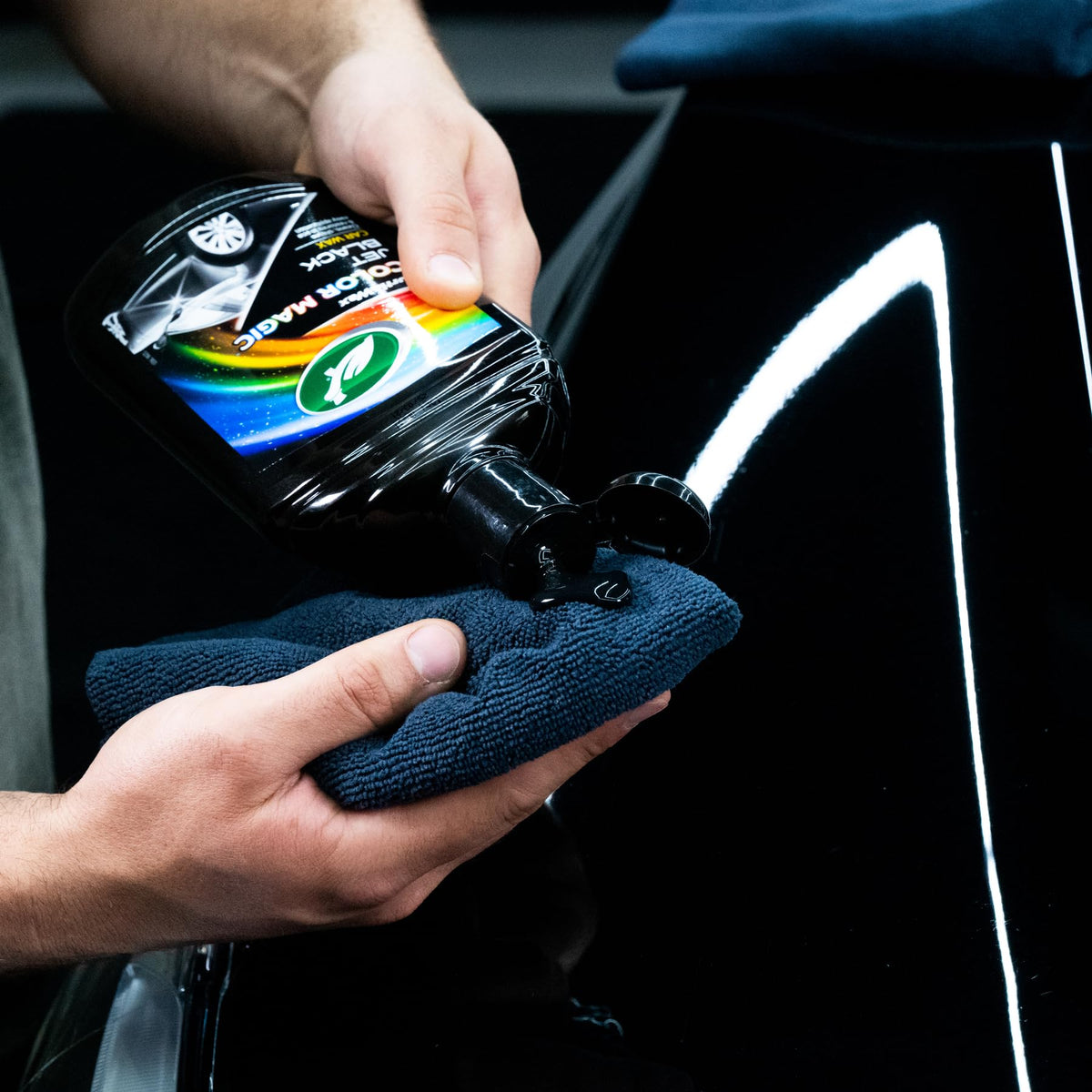 Turtle Wax bottle being poured to show polish consistency and easy use