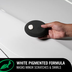 Close-up of Turtle Wax polish texture highlighting smooth consistency