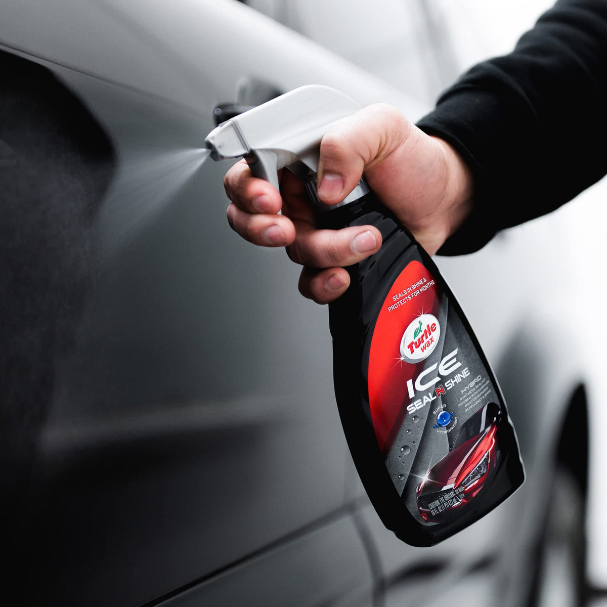 Turtle Wax ICE being wiped with microfiber demonstrating easy one-step shine
