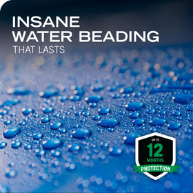 Water beading on car hood demonstrating Turtle Wax extreme repellency