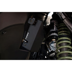 TUSK installed underbody shield protecting A/C lines from trail debris