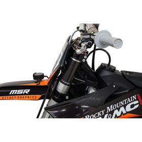 TUSK carbon wrap snap edge detail showing tool-free removal advantage