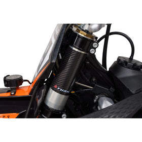 TUSK carbon wrap on trail bike demonstrating stylish protection benefit