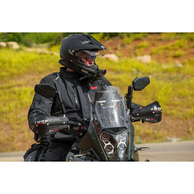 TUSK handguards installed on motorcycle handlebars demonstrating protection and fit