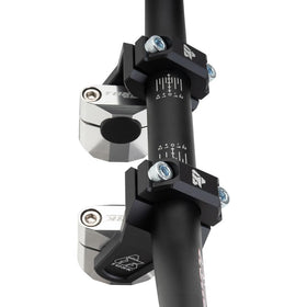TUSK risers on dirt bike in trail setting improving handling and comfort