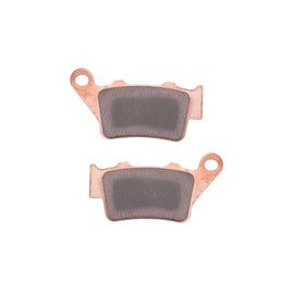 TUSK rear brake pad front view showing complete kit and mounting shape for accurate fit