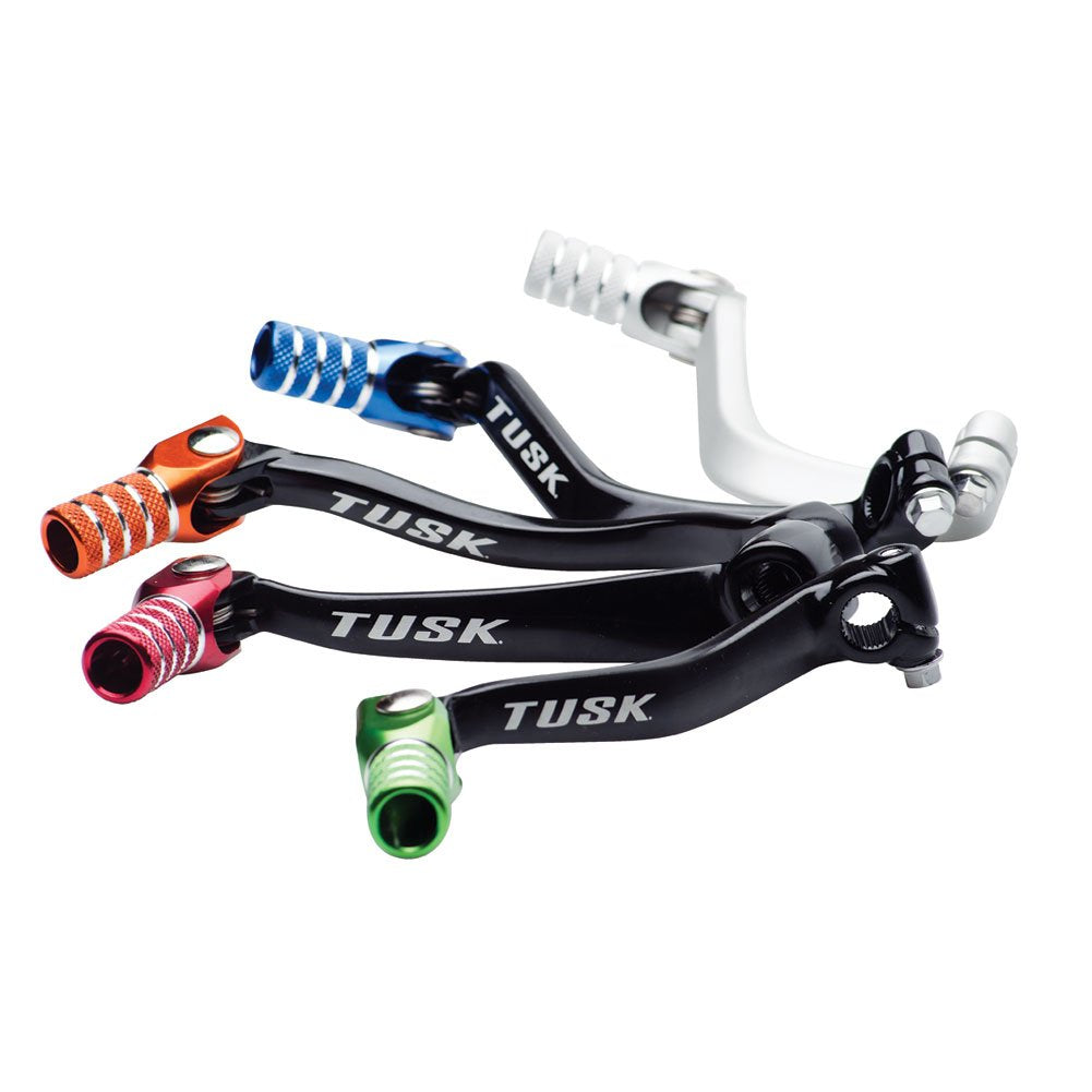 TUSK shift lever beside coin showing compact size and lightweight benefit for handling