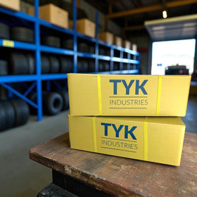 TYK Industries tube beside ruler showing accurate 26x8-12 sizing for correct installation