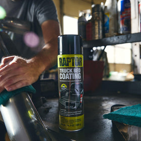 U-POL RAPTOR aerosol being sprayed into a truck bed demonstrating easy application