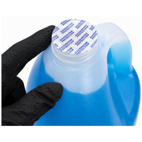 UCS clear fluid texture shown on glass for streak-free benefit