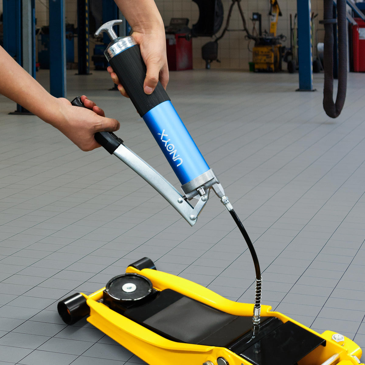 UNOYX tool lubricating tractor bearing demonstrating field reliability