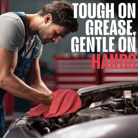 Utopia Towels in hand wiping auto oil showing streak-free cleanup