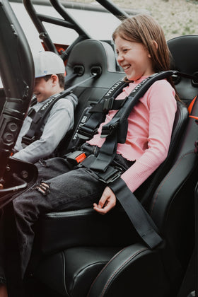UTVMA child rider using cushion improving visibility and comfort