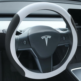 Uxcer front view showing white cover on Tesla steering wheel enhancing cabin style