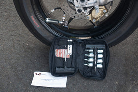 V1 Motor kit held in hand for size comparison and travel-friendly benefit