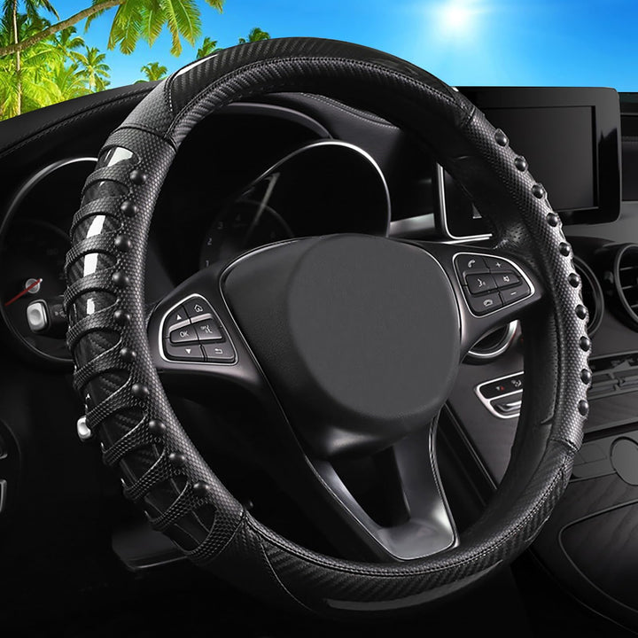 vaitarkli front view of black carbon fibre steering wheel cover, shows clean styling and protection