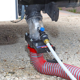 Valterra Flush King held in hand showing compact size and portable convenience
