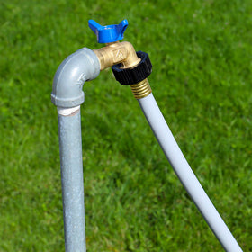 Valterra hose at a campsite setup with RV illustrating tidy, safe waste management benefit