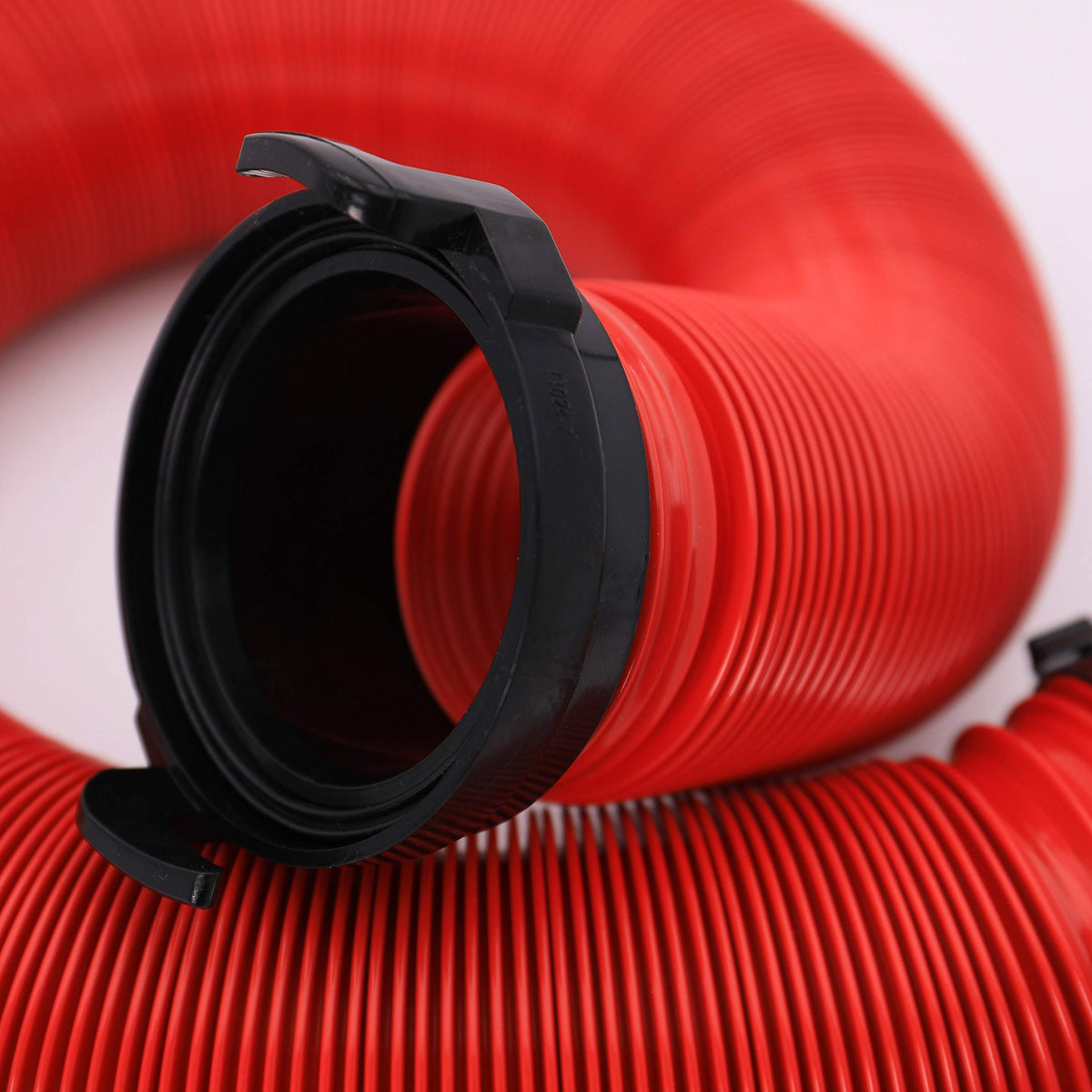 Valterra hose beside ruler showing compact collapsed size for space saving