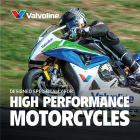 Valvoline bottle in garage next to motorcycle supporting maintenance readiness