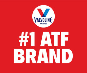 Mechanic in garage using Valvoline ATF during routine transmission service