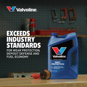 Valvoline bottle being used in an engine bay showing proper application