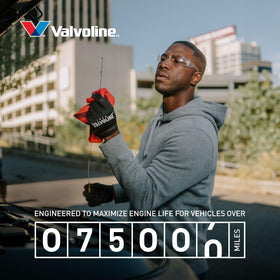 Valvoline bottle in a garage lifestyle scene highlighting trusted American brand protection