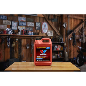 Valvoline bottle in garage setting demonstrating practical use