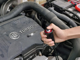 VCC starter switch held in hand showing compact size and portable benefit