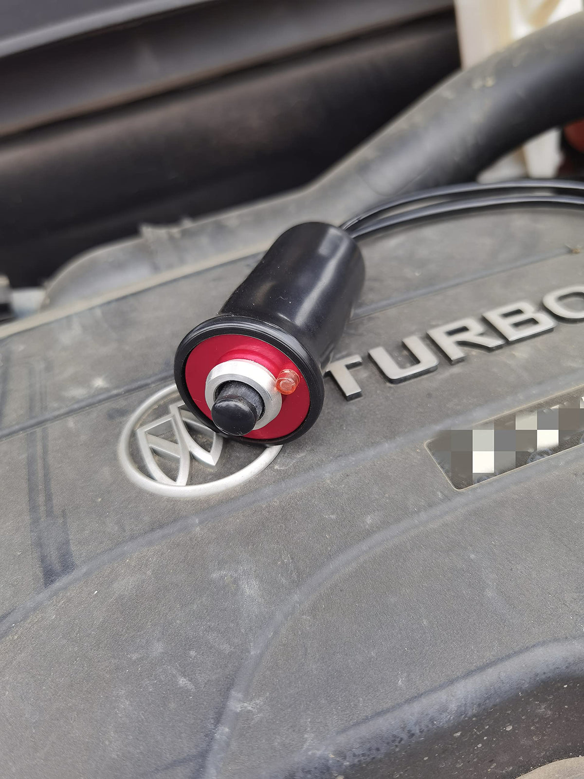 VCC starter switch in-use under hood enabling safe remote engine cranking