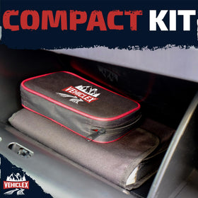 Vehiclex kit next to a hand showing compact size and travel convenience benefit
