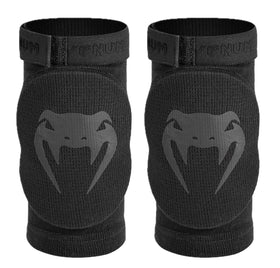 Venum Kontact elbow protector front view showing sleek black design and secure fit