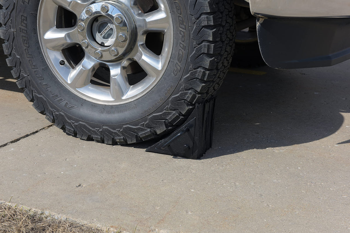 Vestil LWC-15 placed against a truck wheel demonstrating stability