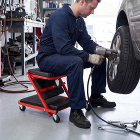 VEVOR lifestyle garage shot of creeper during repair showing workflow efficiency benefit
