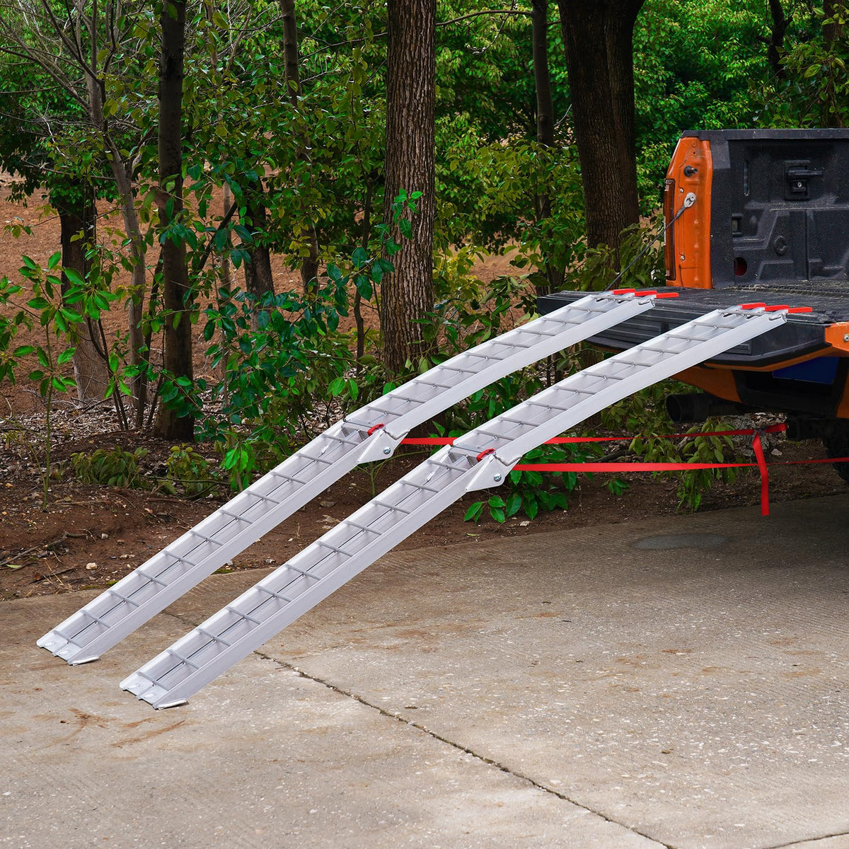 VEVOR ramp next to a lawn mower illustrating scale and weight-handling suitability