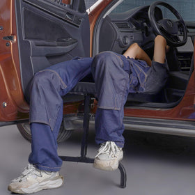 VEVOR creeper used inside a car under the dashboard offering hands-on access benefit
