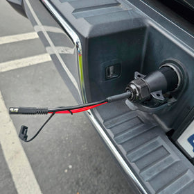 VIAIR adapter plugged into truck 7-way hitch powering compressor for roadside use benefit