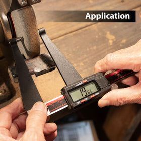VINCA gauge beside a ruler for scale showing compact 0–6 inch capacity and portability