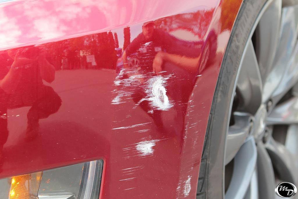 VViViD installation in progress with squeegee for bubble-free adhesion