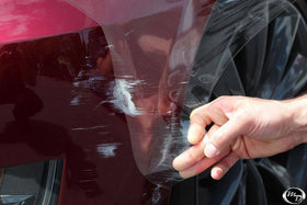 VViViD protected car parked outdoors showing long-lasting defense against road debris benefit
