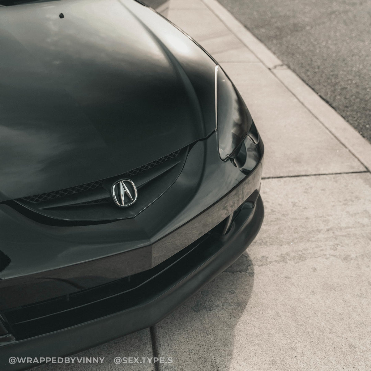 VViViD applied to car hood demonstrating seamless high-gloss automotive look
