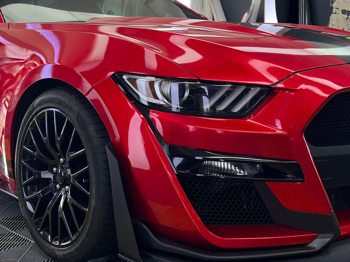 VViViD metallic candy red texture close-up revealing deep reflective metallic depth