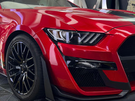 VViViD metallic candy red texture close-up revealing deep reflective metallic depth