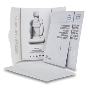 Volvo leather care wipe cleaning seat close-up, restores appearance and softens surface