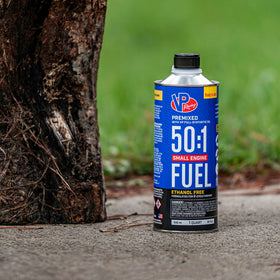 VP Racing pouring into trimmer tank demonstrating ready-to-use fuel for fast starts